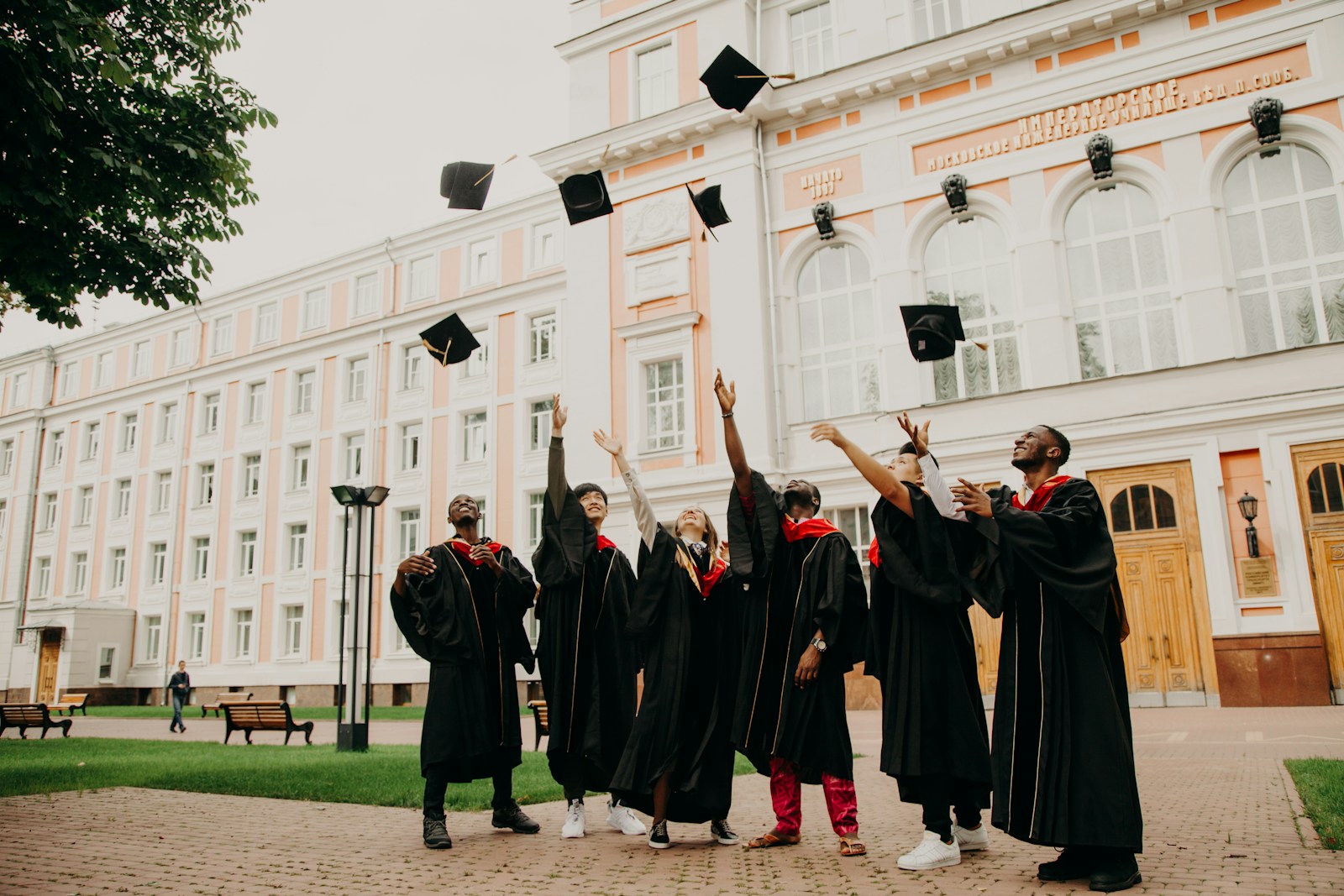 Graduation caps thrown in the air